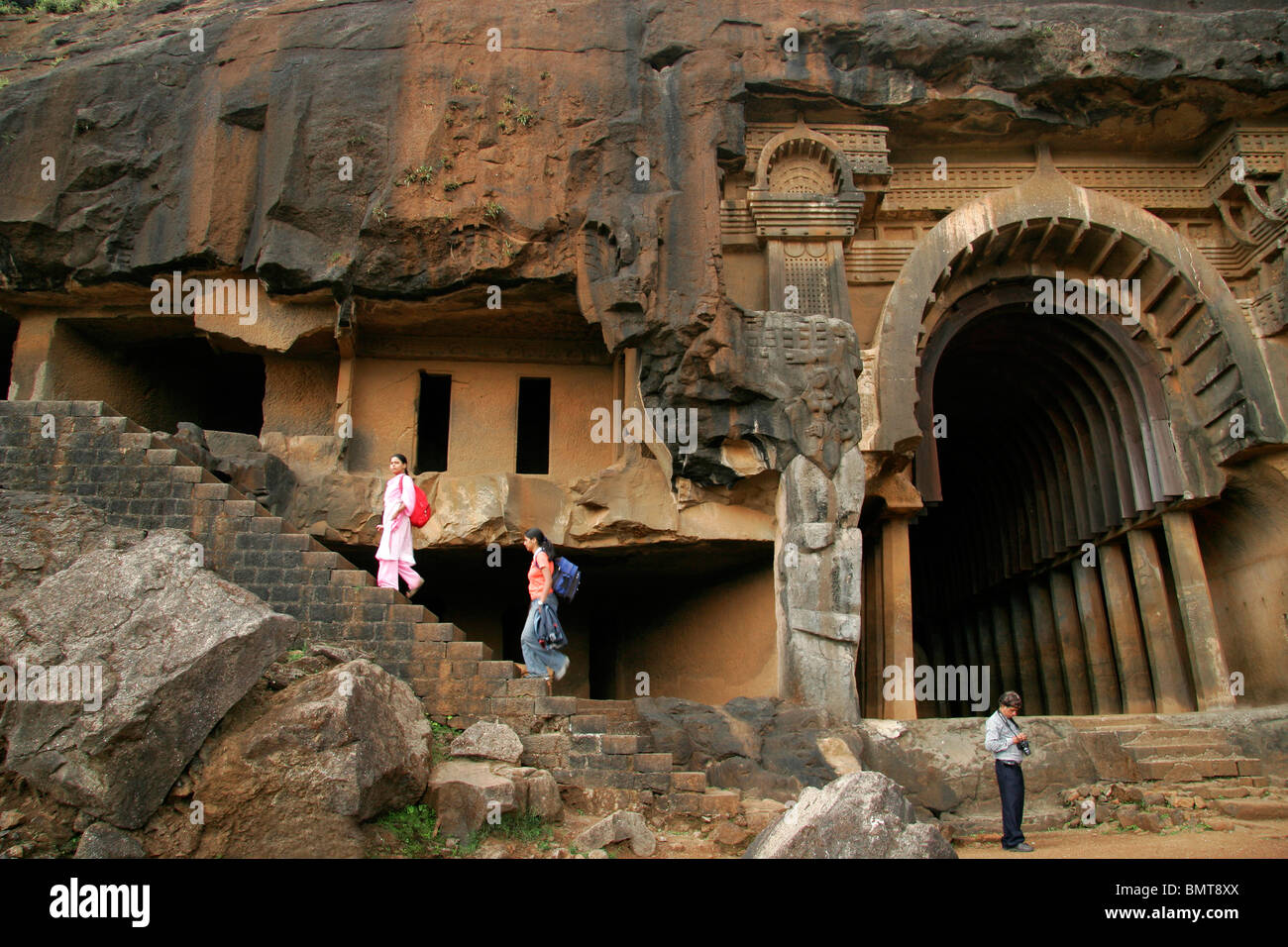 Tourists at Indian heritage place called Bhaja caves with Chaitya ; Lonavala ; Maharashtra ;  India Stock Photo