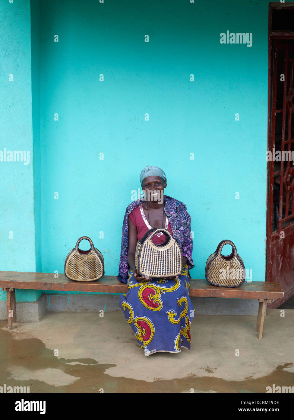 African lady with three weaved bags in Rwanda, post genocide Stock Photo