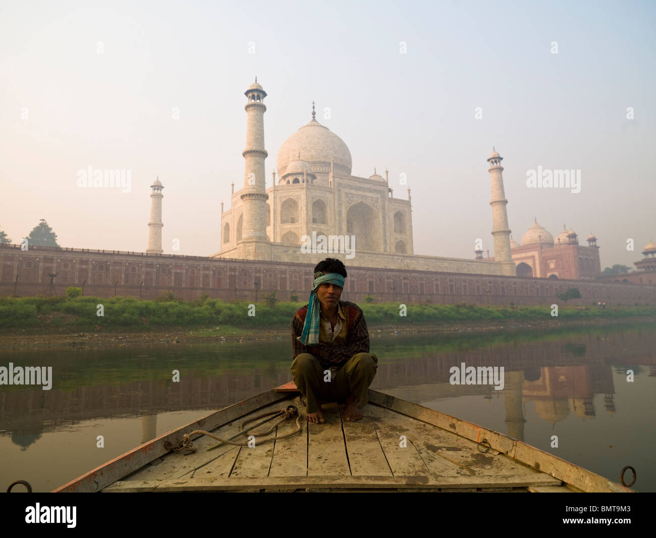 Taj Mahal,Agra,India;Man Sitting On A Boat By The Taj Mahal Stock Photo