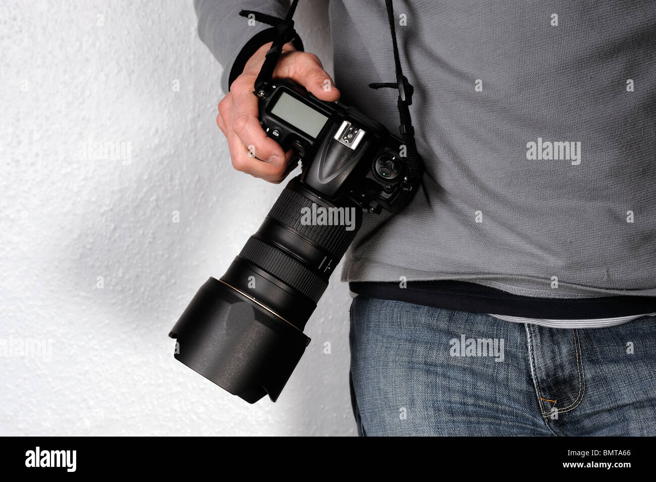 Man holding a camera Stock Photo