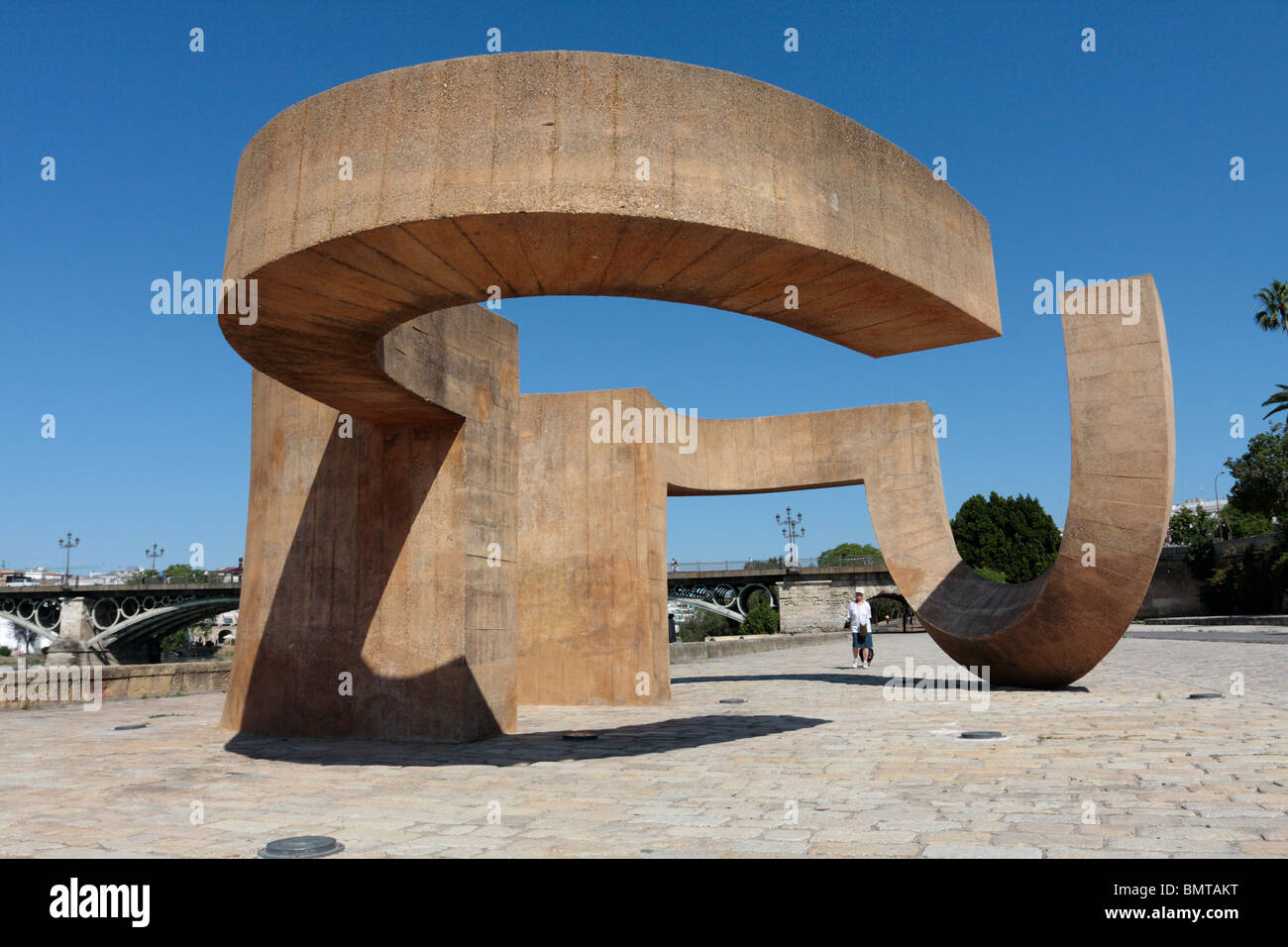 Monument to 'La Tolerancia' by Eduardo Chillida on the bank of the river Guadalquivir near the bridge of Isabel 2nd in Seville Stock Photo