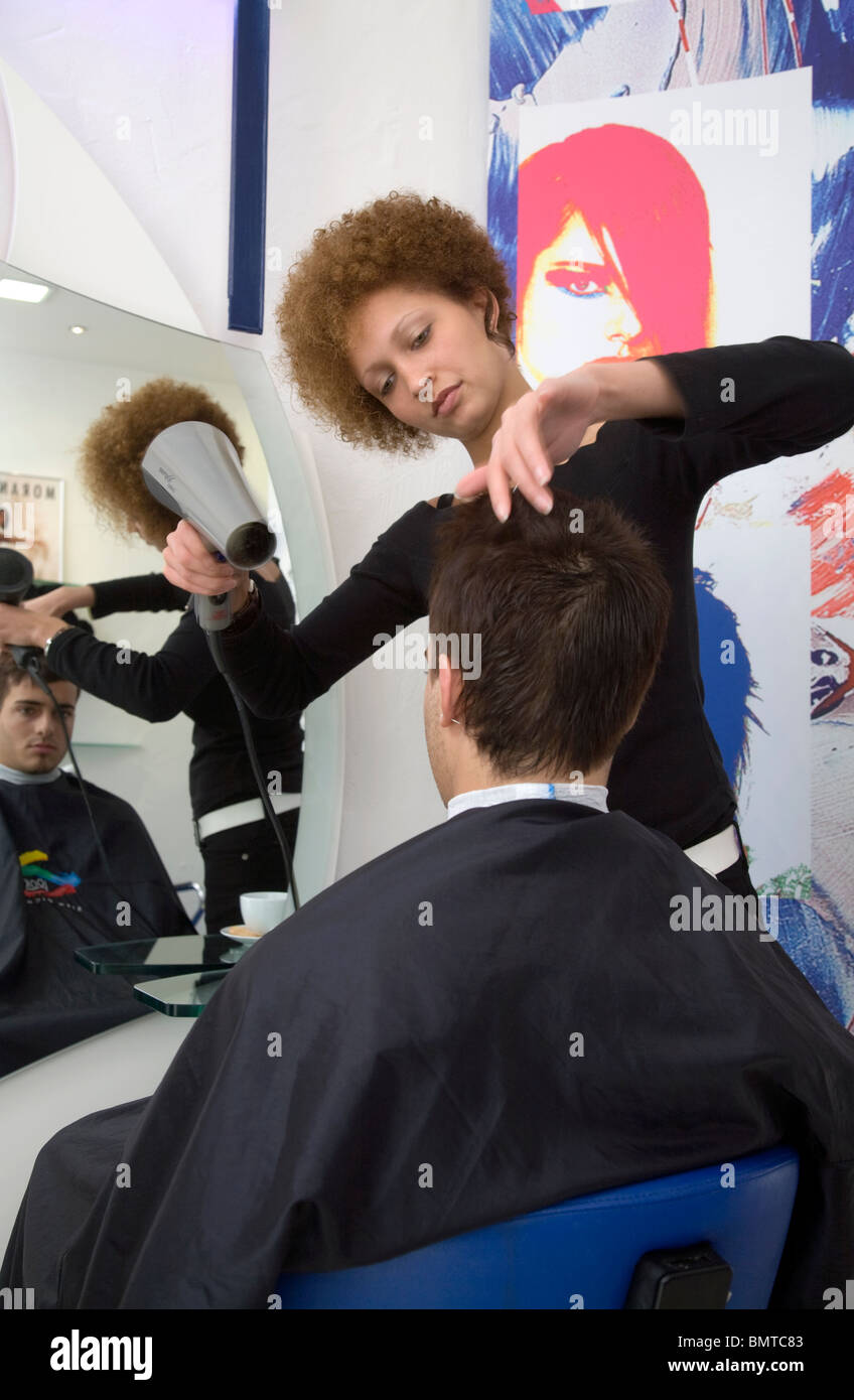 A trainee hairdresser in the Morante salon, Essen, Germany Stock Photo