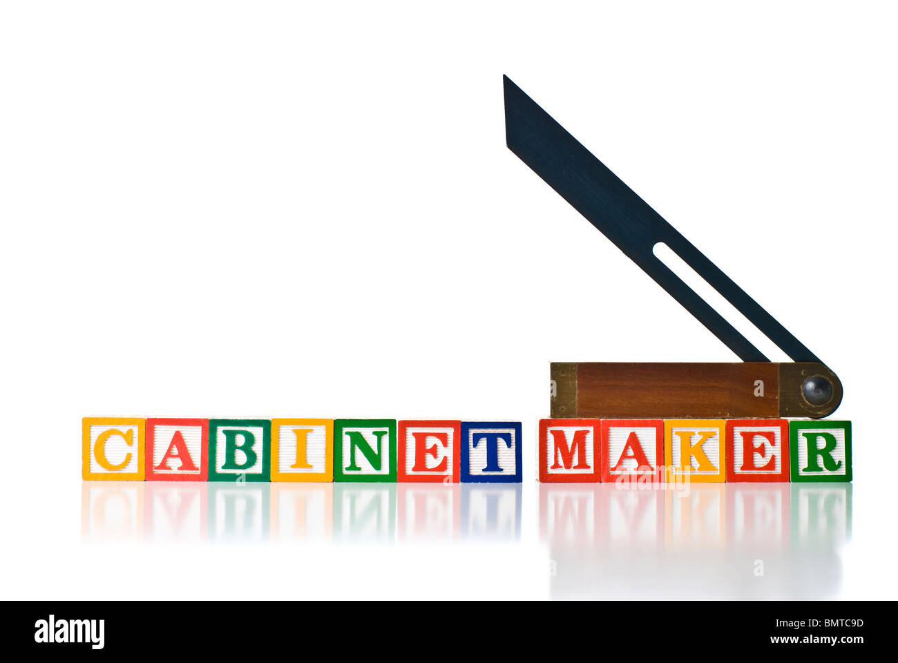 Colorful children's blocks spelling MAKER with a sliding bevel