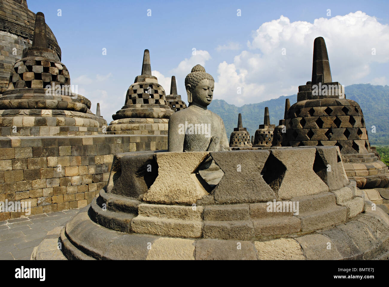 Indonesia-Java-Borobudur, Buddha in Padmasana in one of the perforated stupa (upper portion of the stupa  missing). Stock Photo