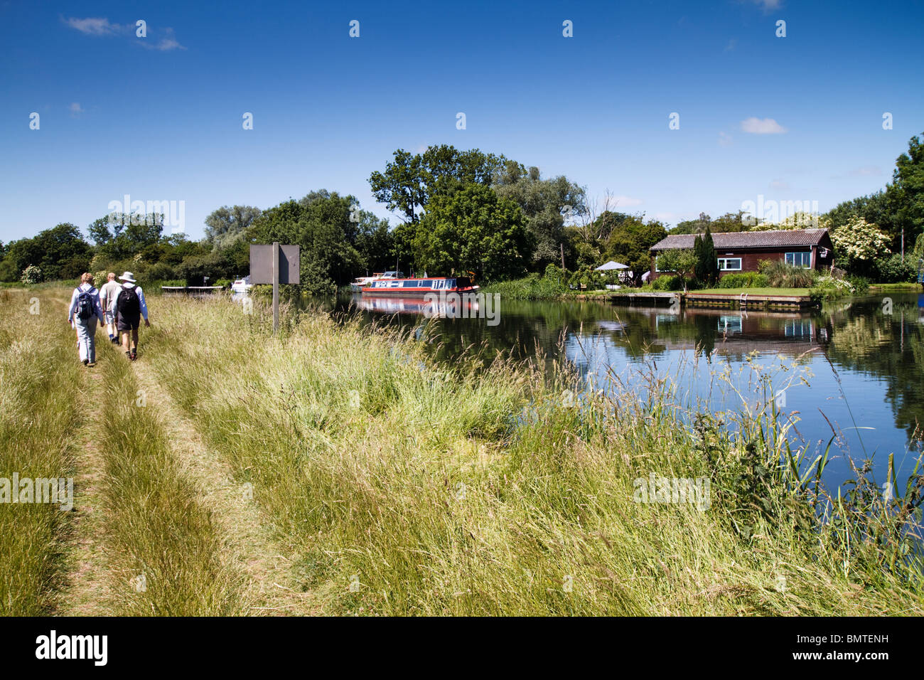 The River 'Great Ouse' People Walking Along The Riverbank, The River Ouse Cambridgeshire England UK Stock Photo