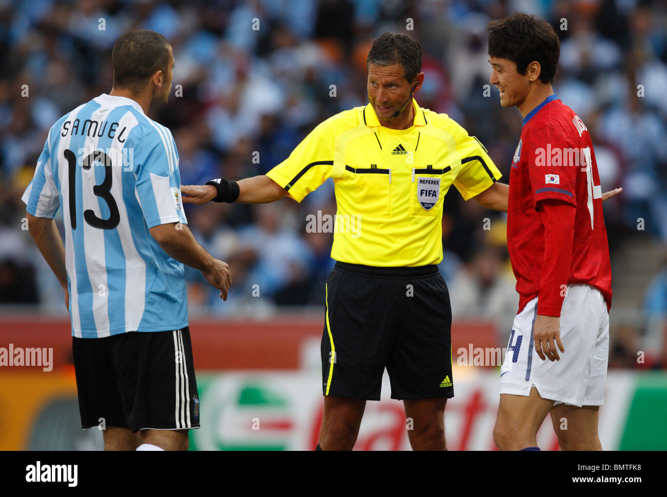 Referee Frank De Bleeckere mediates between Walter Samuel of Argentina and  Jung Soo Lee of South Korea in a 2010 World Cup match Stock Photo - Alamy