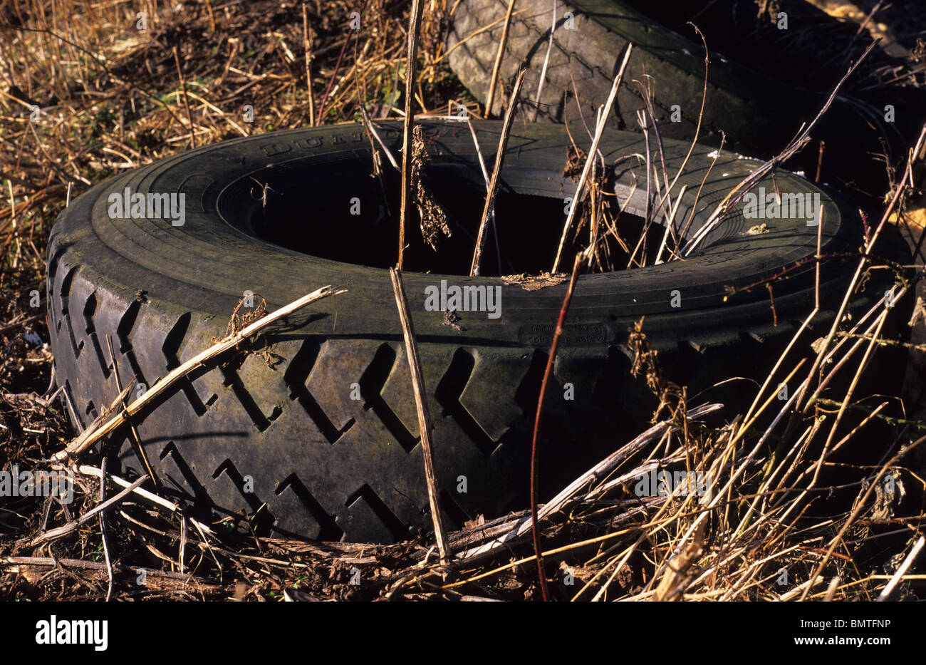 old lorry tyres left at the roadside UK Stock Photo