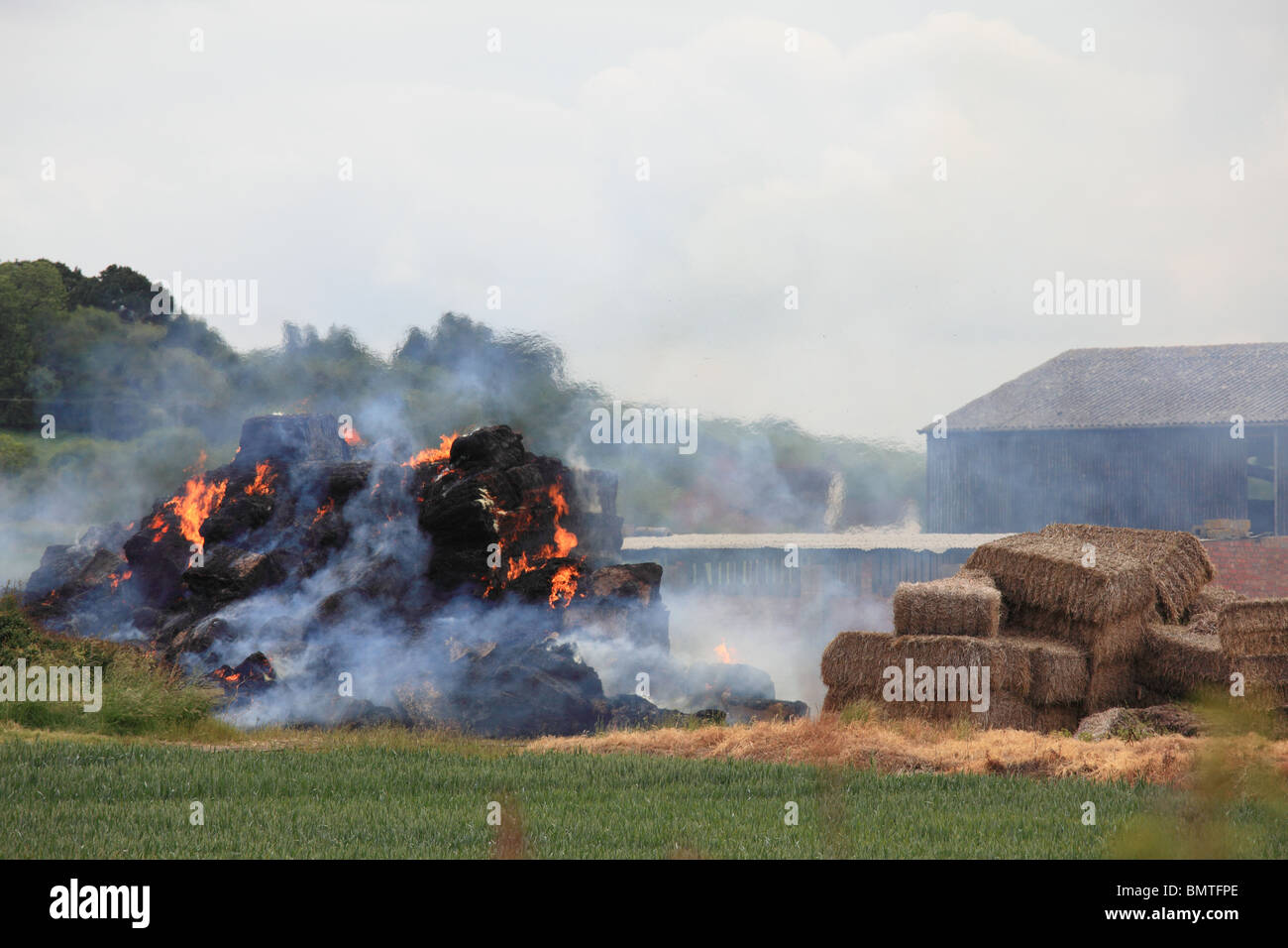Bales of hay on fire at a farm in rural Warwickshire Stock Photo Alamy