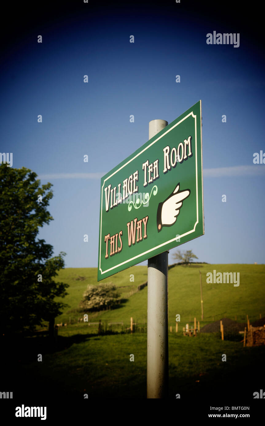 sign pointing to Village tea room Stock Photo