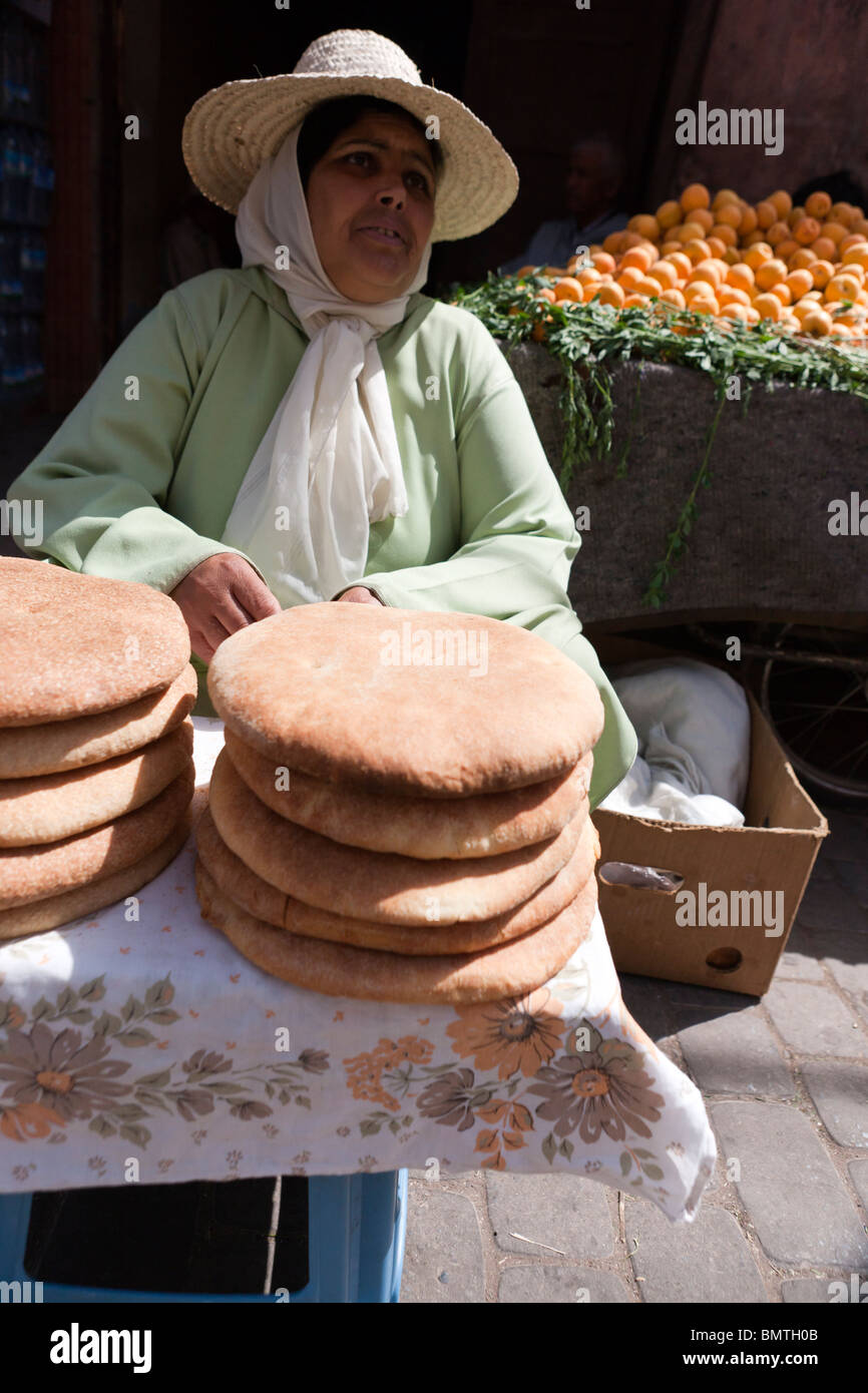 A woman selling bread on the street. Marrakech. Morocco. Africa. Stock Photo