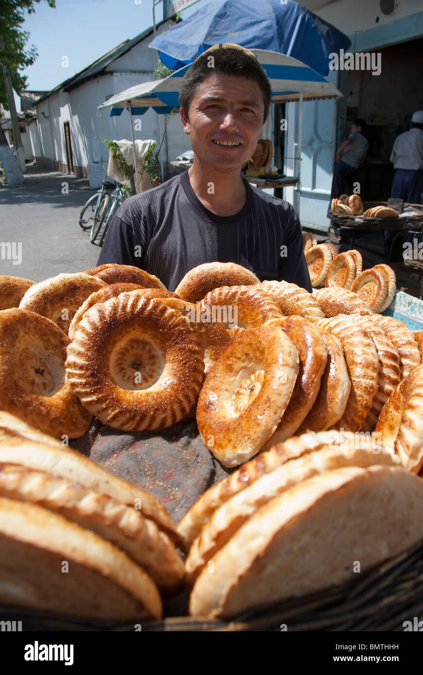 Man selling fresh bread in street hires stock photography and images