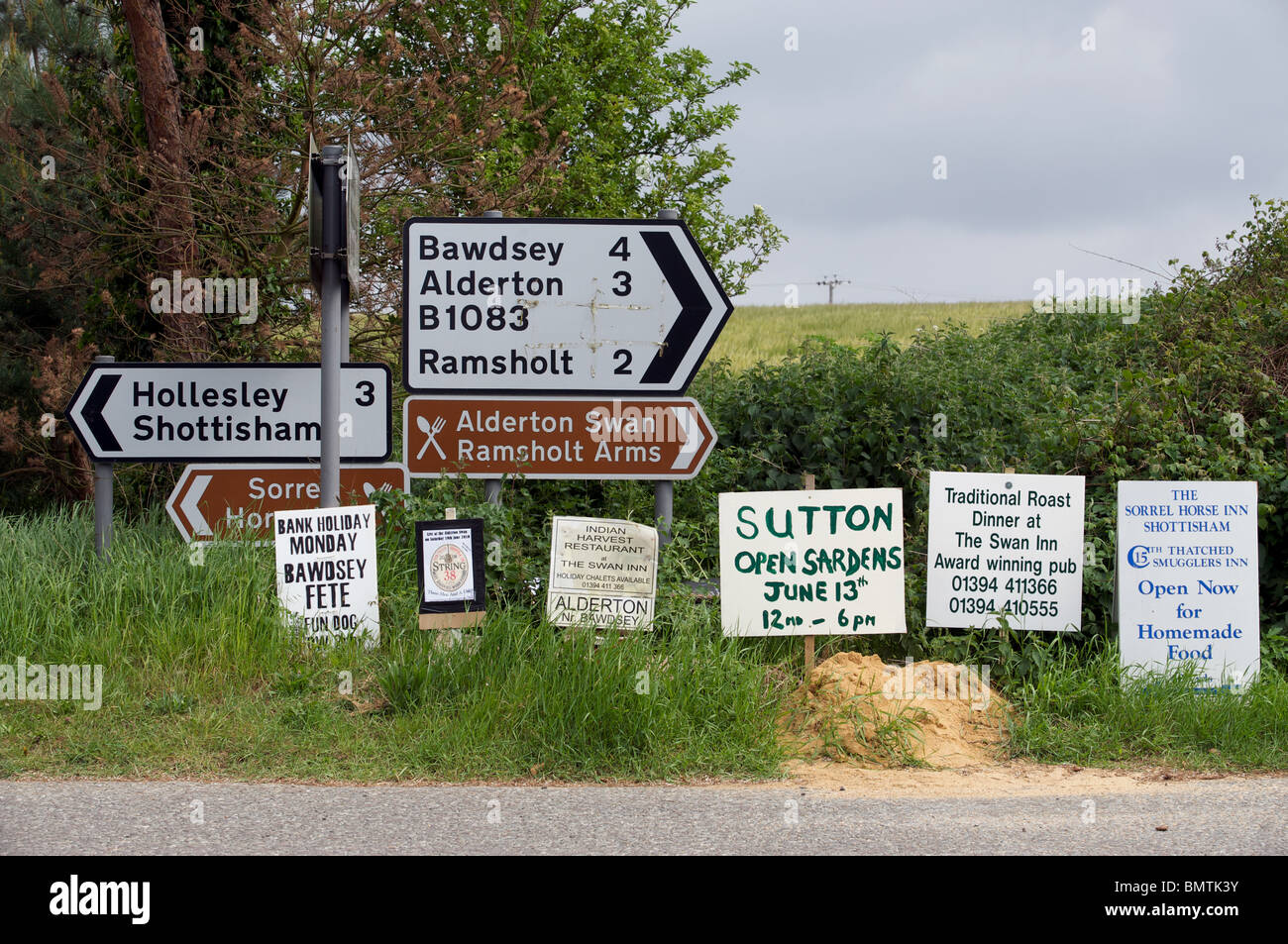 Homemade advertising boards beside a road junction, Shottisham, Suffolk, England. Stock Photo