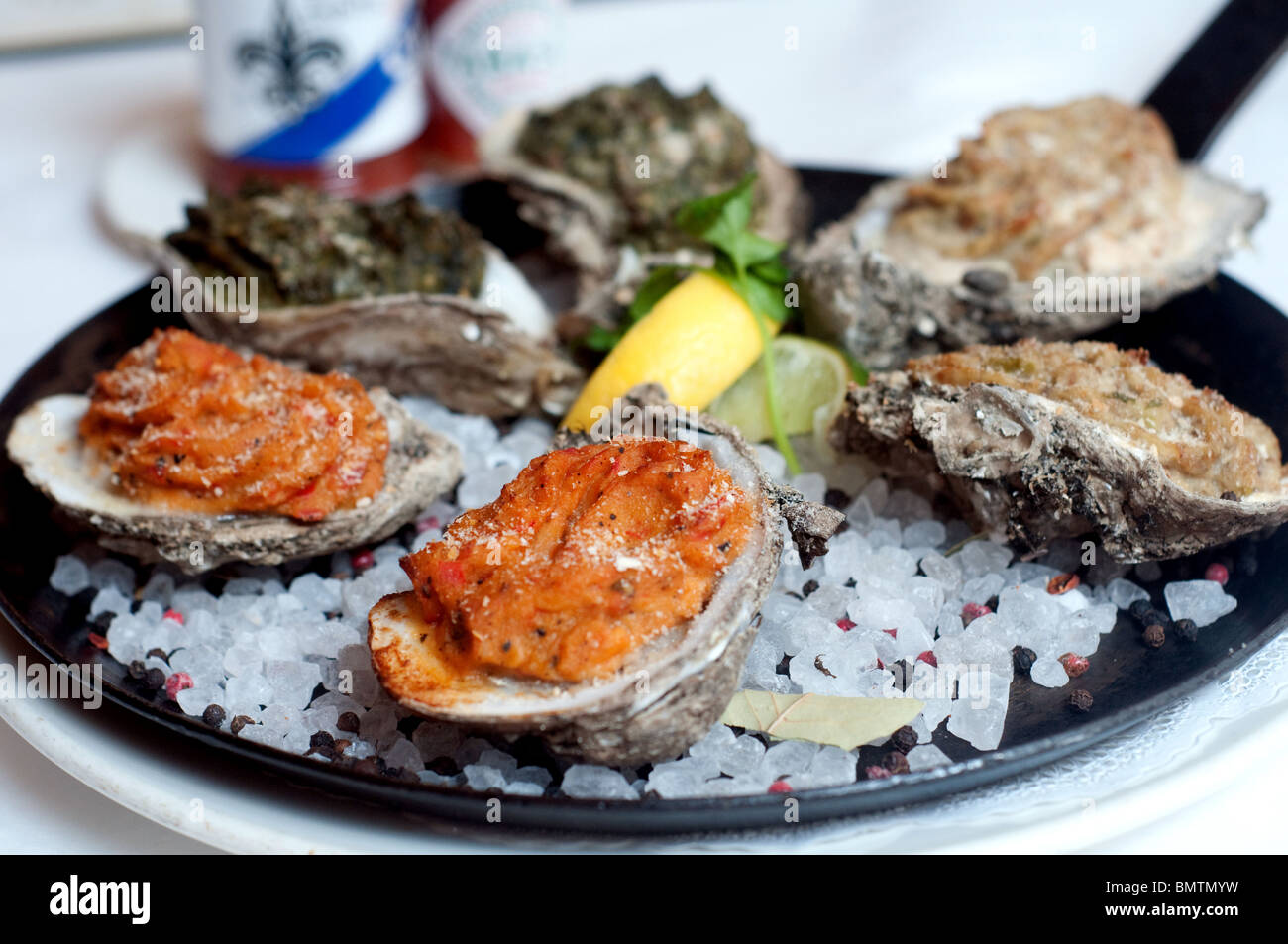 A serving of baked oysters au gratin from Dickie Brennan's Bourbon House, a famous restaurant in New Orleans, Louisiana, United States. Stock Photo