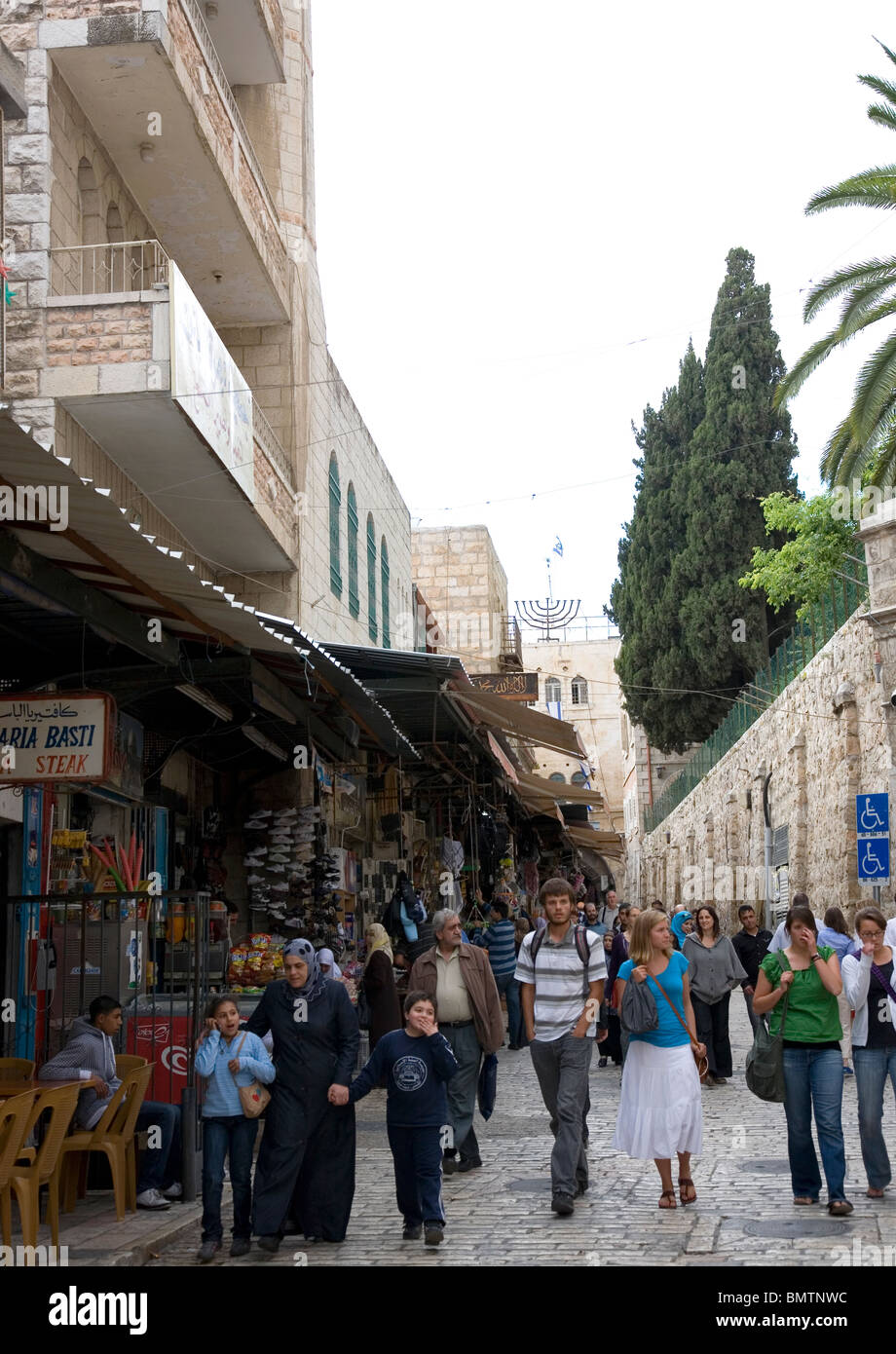 Tourists walking along  El-Wad in Jerusalem , Muslim quarter - Israel Stock Photo