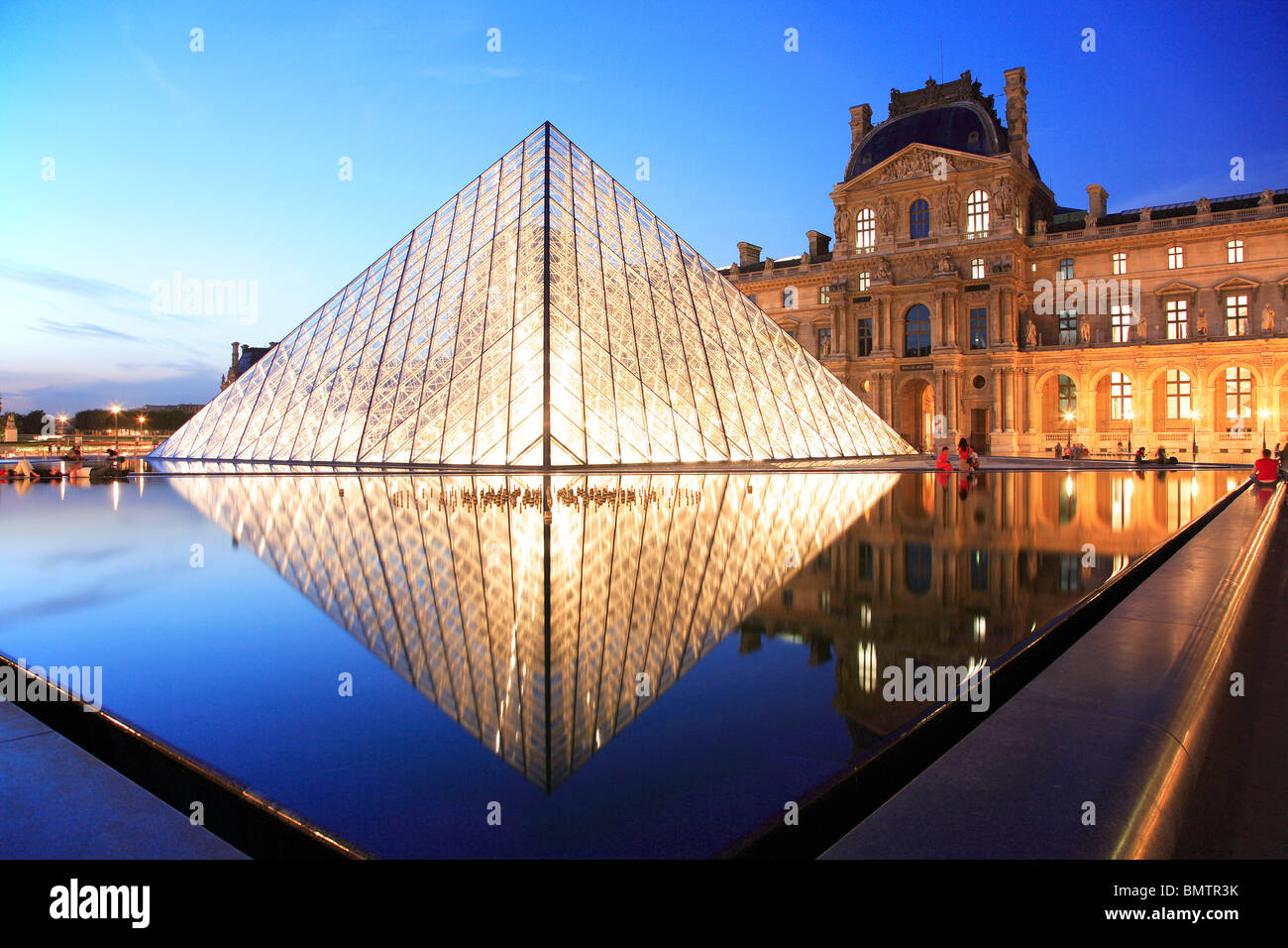 Louvre Museum and Pyramid by the architect Ieoh Ming Pei Stock Photo