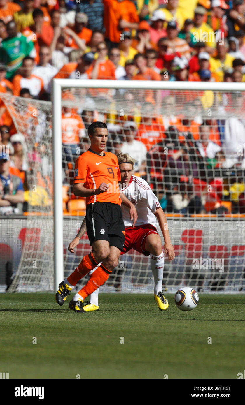 Robin van Persie of the Netherlands (l) in action against Simon Kjaer of Denmark (r) during a 2010 World Cup football match. Stock Photo