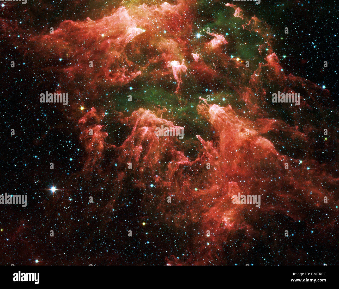 Enhanced version of the Carina Nebula photographd by the Spitzer Space Telescope. Please credit Nasa Stock Photo