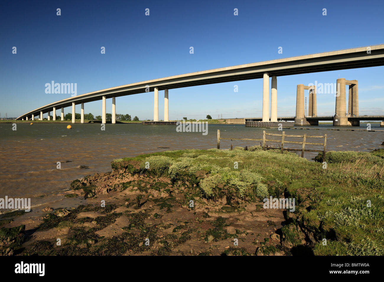 The new Isle of Sheppey crossing towers over the old Kingsferry crossing. Stock Photo