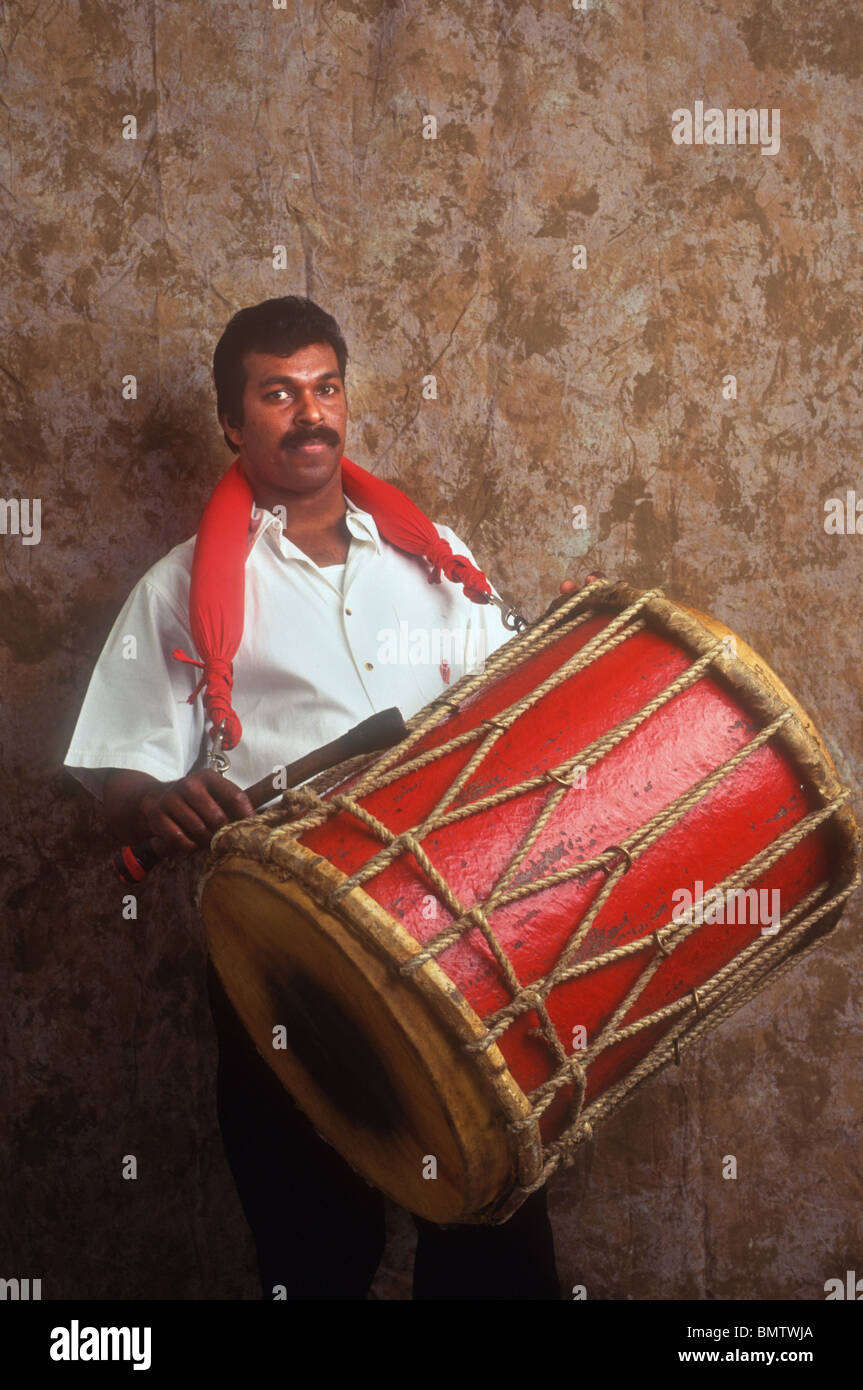 Indian man playing a drum Stock Photo