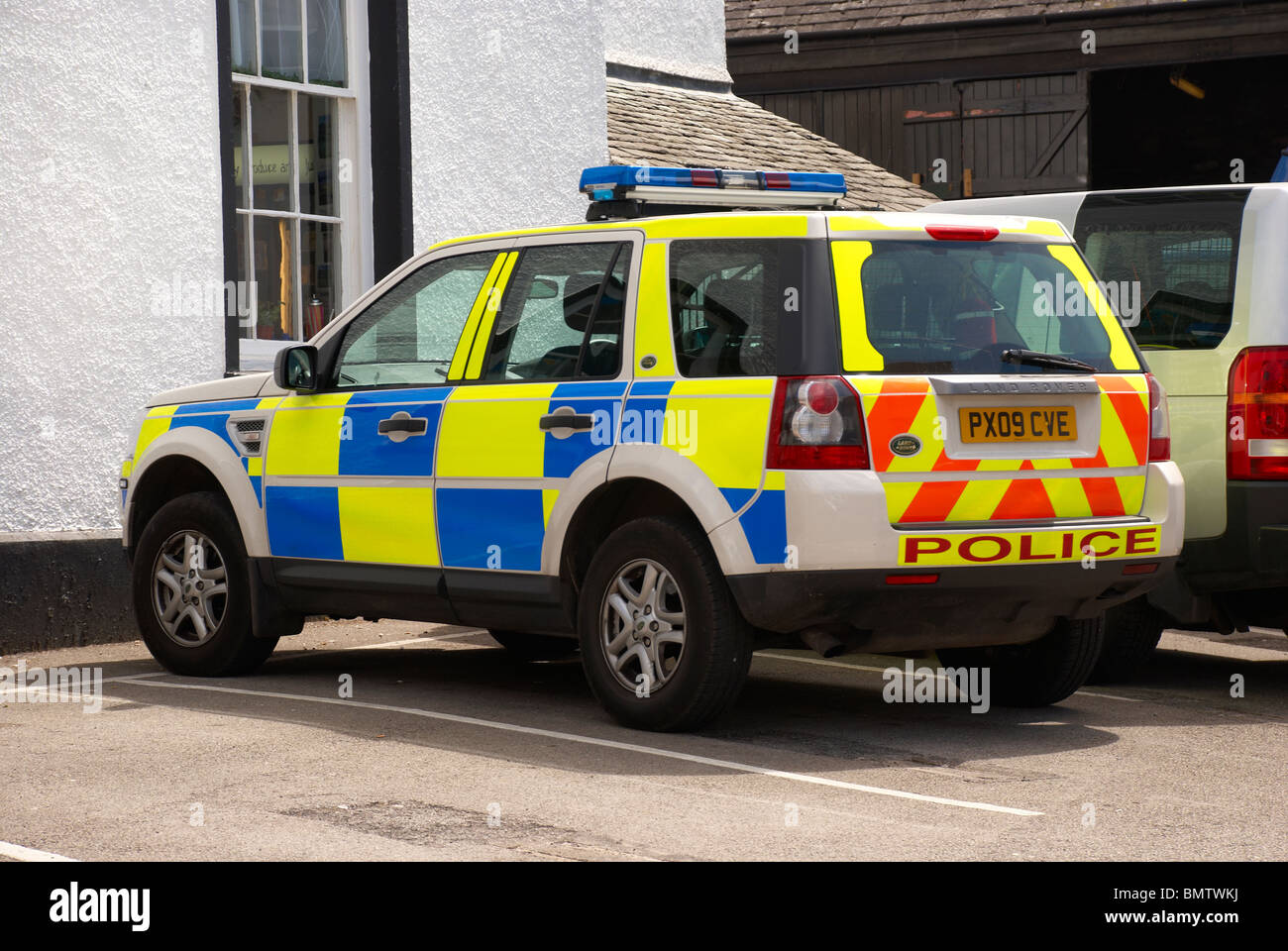 Police car parked in a hotel / pub car park in the lakes. Stock Photo