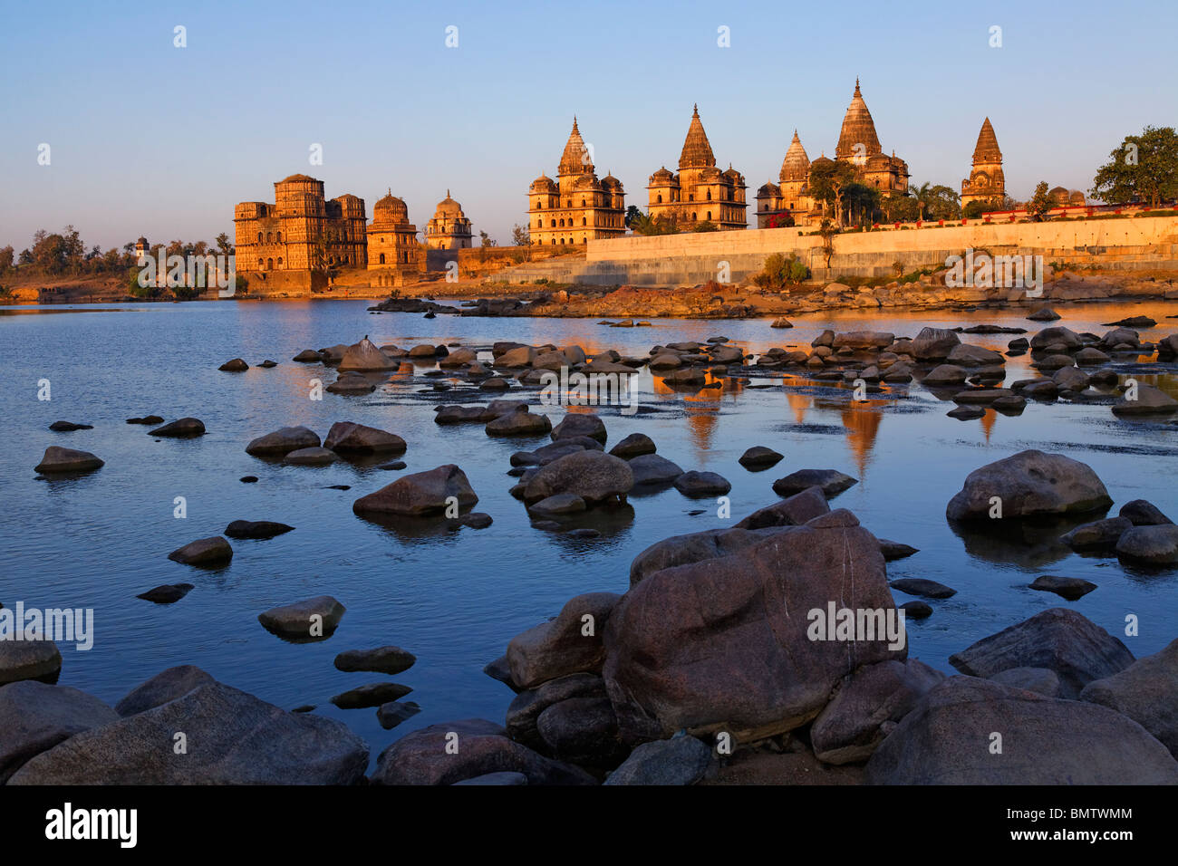 Chhatris across the Betwa River at sunrise, Orchha, Madhya Pradesh, India Stock Photo