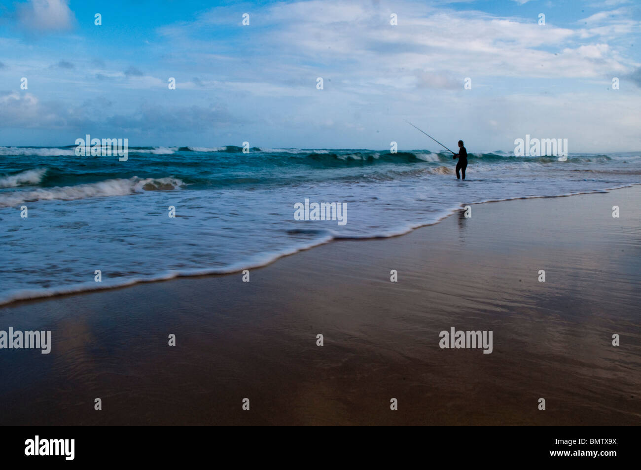 one fishing pole on an empty beach during a rainy day Stock Photo - Alamy