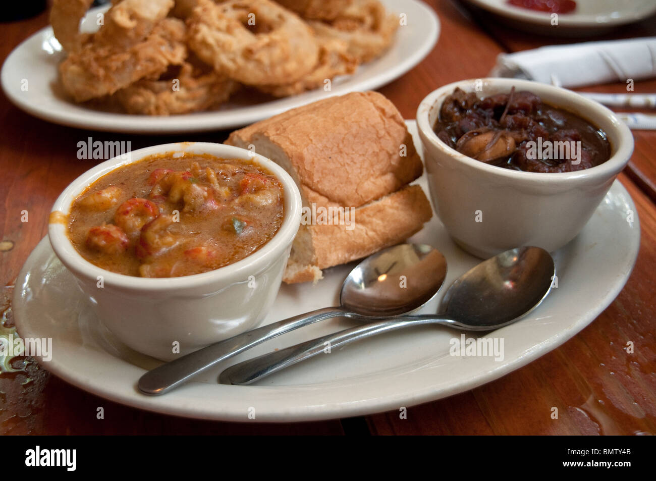 Cups of seafood gumbo and crawfish etouffee served at a roadhouse cajun and creole restaurant in Shreveport, Louisiana, United States. Stock Photo