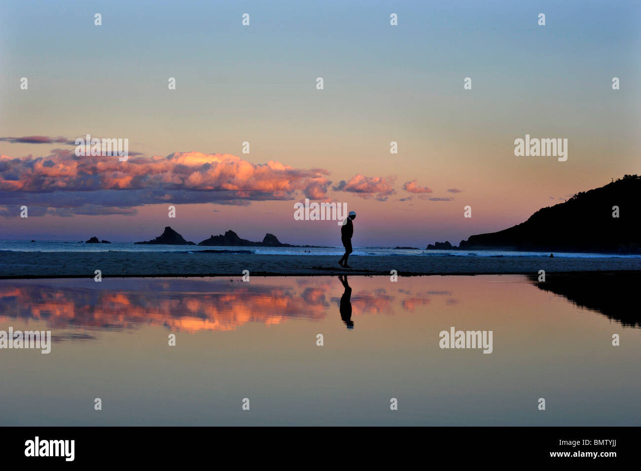 Tallow Beach Sunset Byron Bay with Broken head and the three sisters Stock Photo