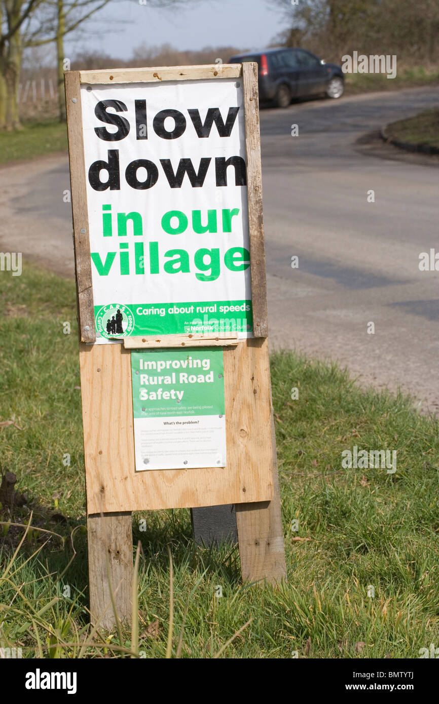 Signs; improving rural safety. 'Slow Down in Our Village'. Hickling. Norfolk. East Anglia. England. UK. GB. Stock Photo
