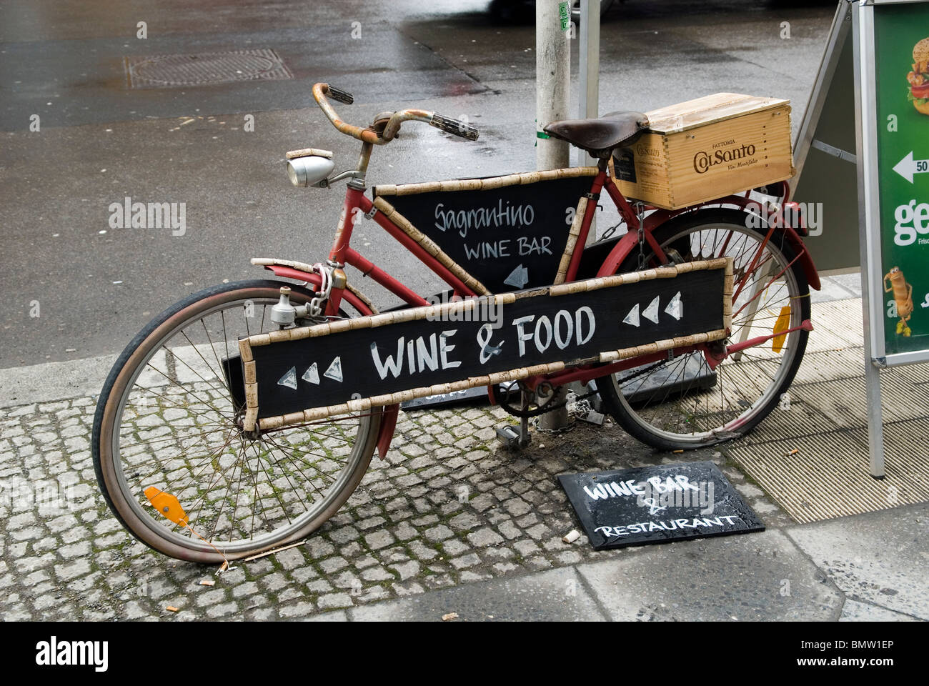 Wine bar sign on an old bicycle Berlin city Germany Stock Photo