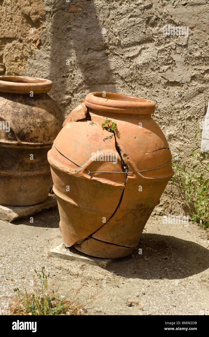 Cracked Terracotta Pot wired together Stock Photo Alamy