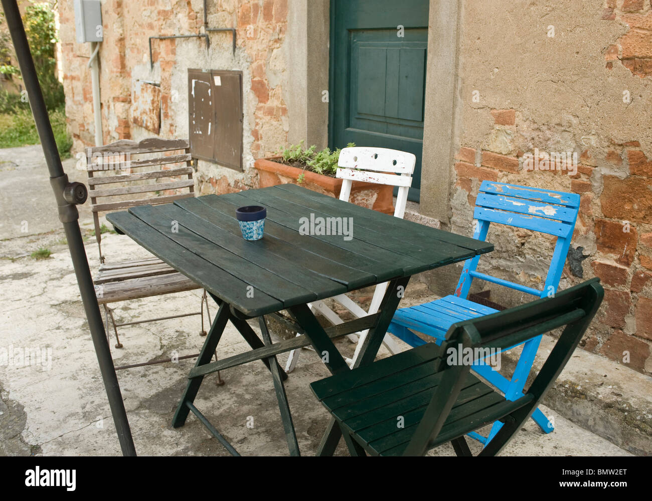Cafe Table with multi-coloured chairs Stock Photo