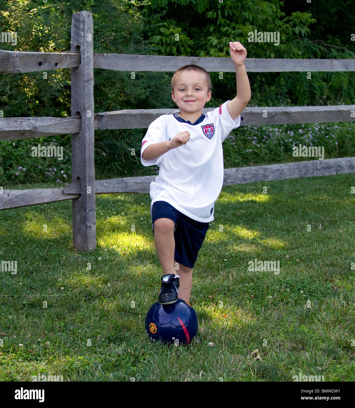 A little boy toddler with a blue soccer ball Stock Photo Alamy
