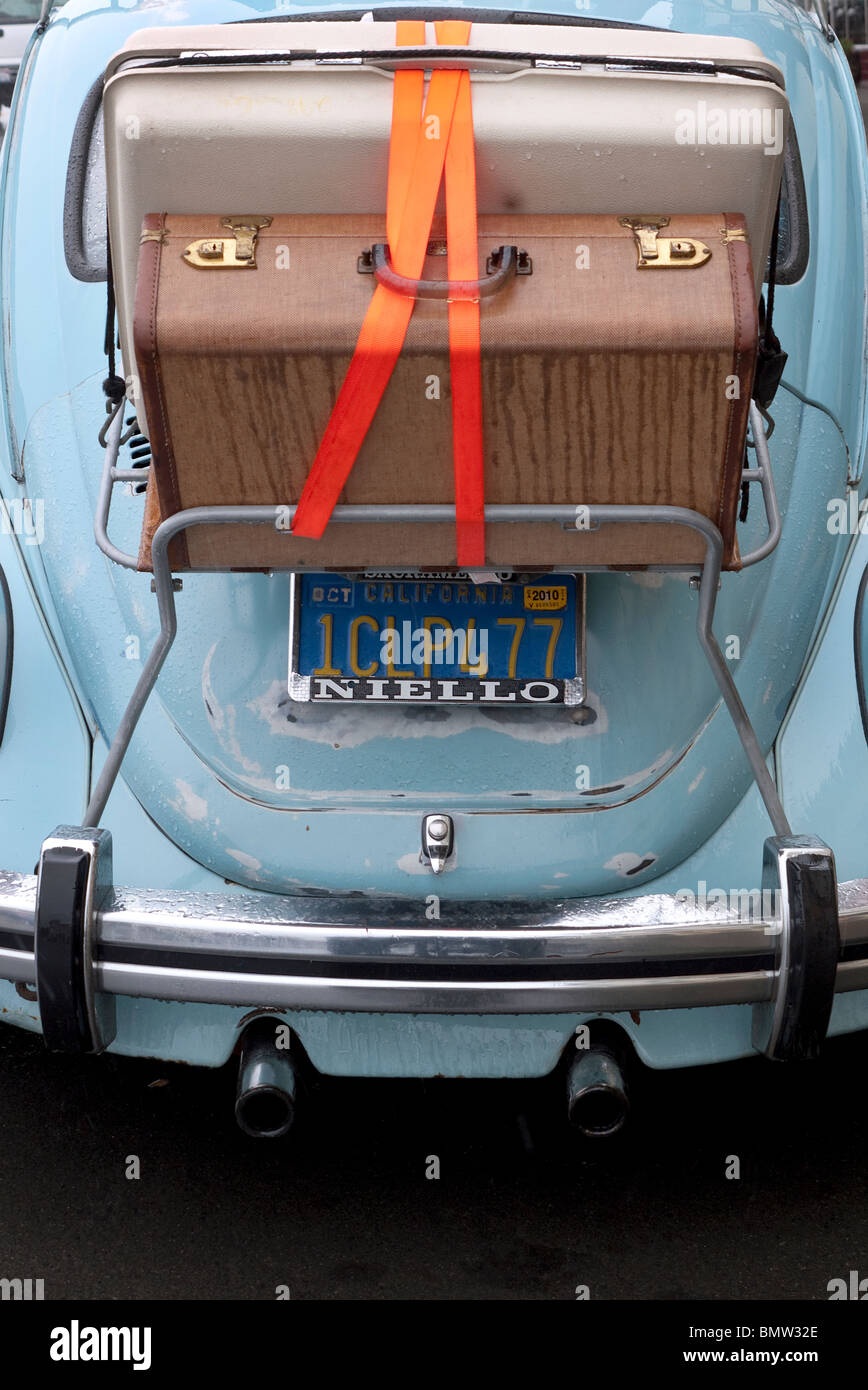 Luggage on rack attached to 1960's automobile Stock Photo