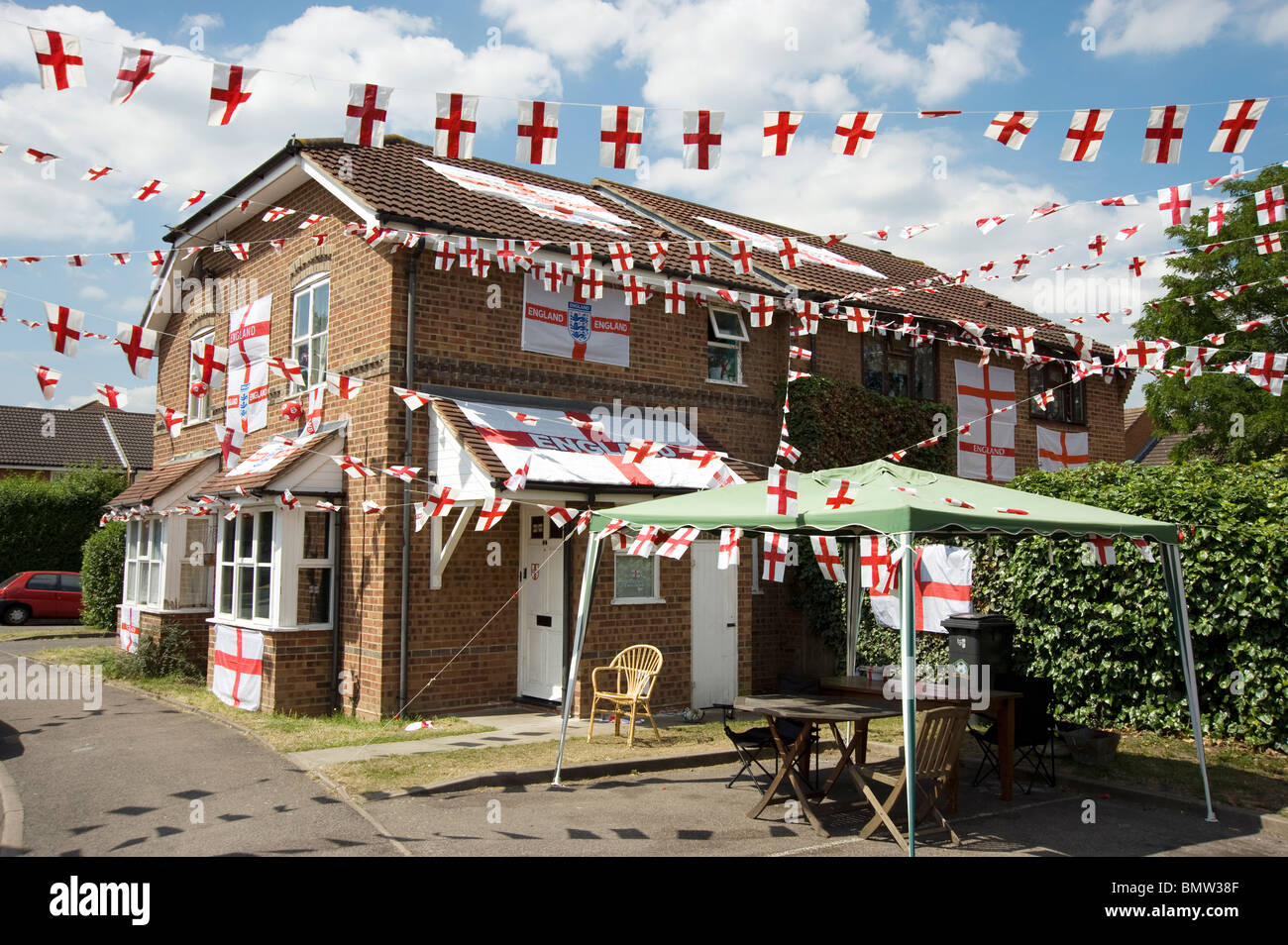 A modern house festooned with bunting and England Flags during the 2010