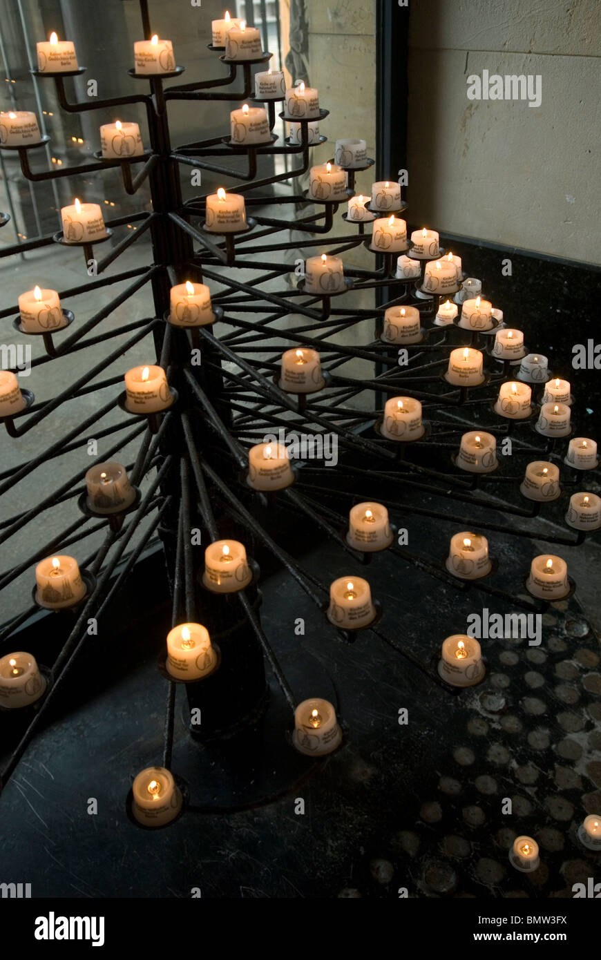 Candles display inside Kaiser Wilhelm Gedächtniskirche memorial church Stock Photo