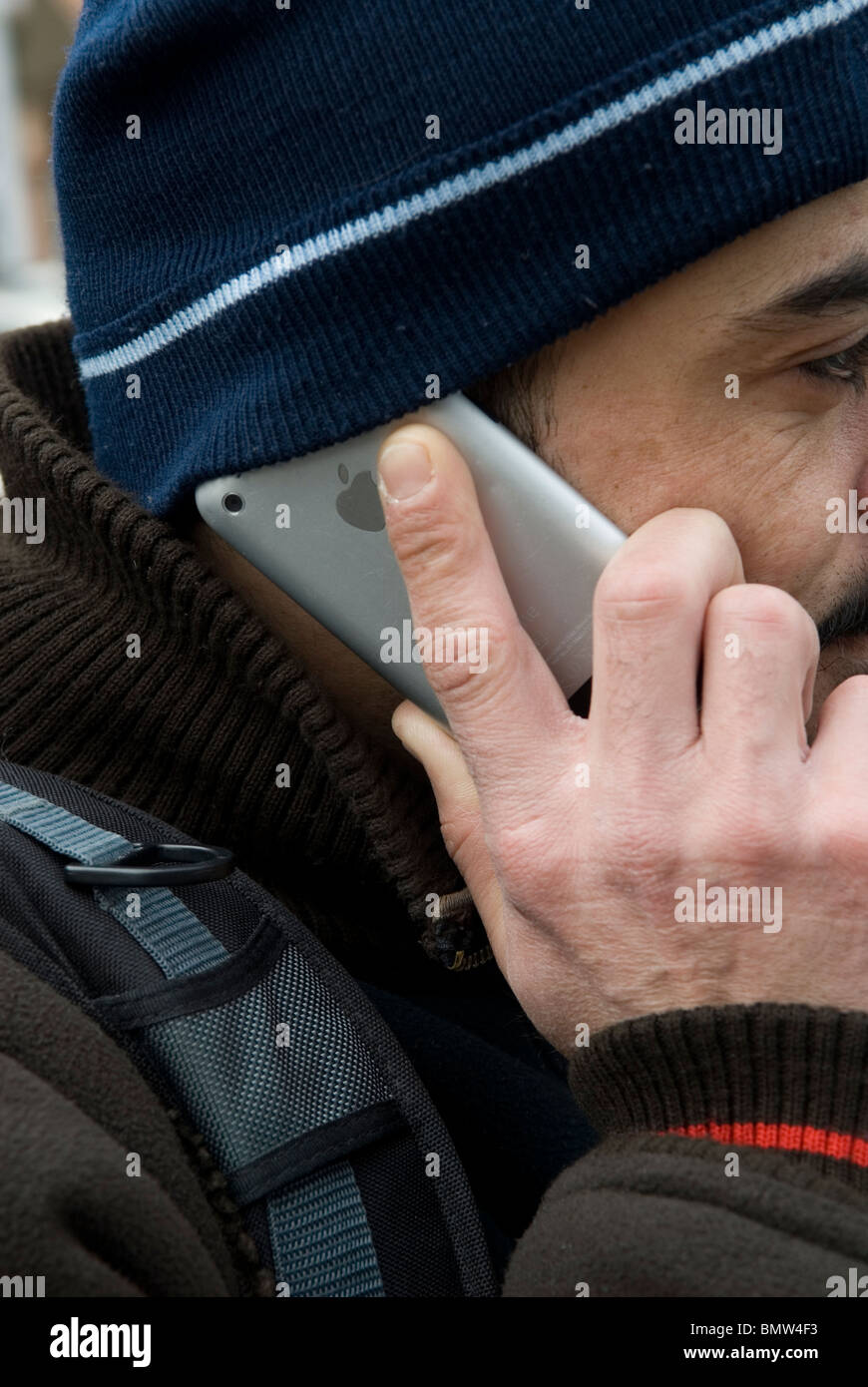 Man using Iphone mobile phone Stock Photo