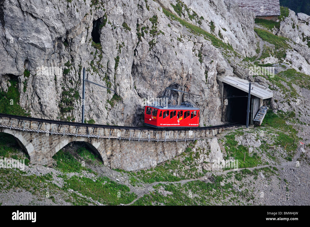 The rack and pinion railway up Mount Pilatus, central Switzerland, with train approaching the summit Stock Photo