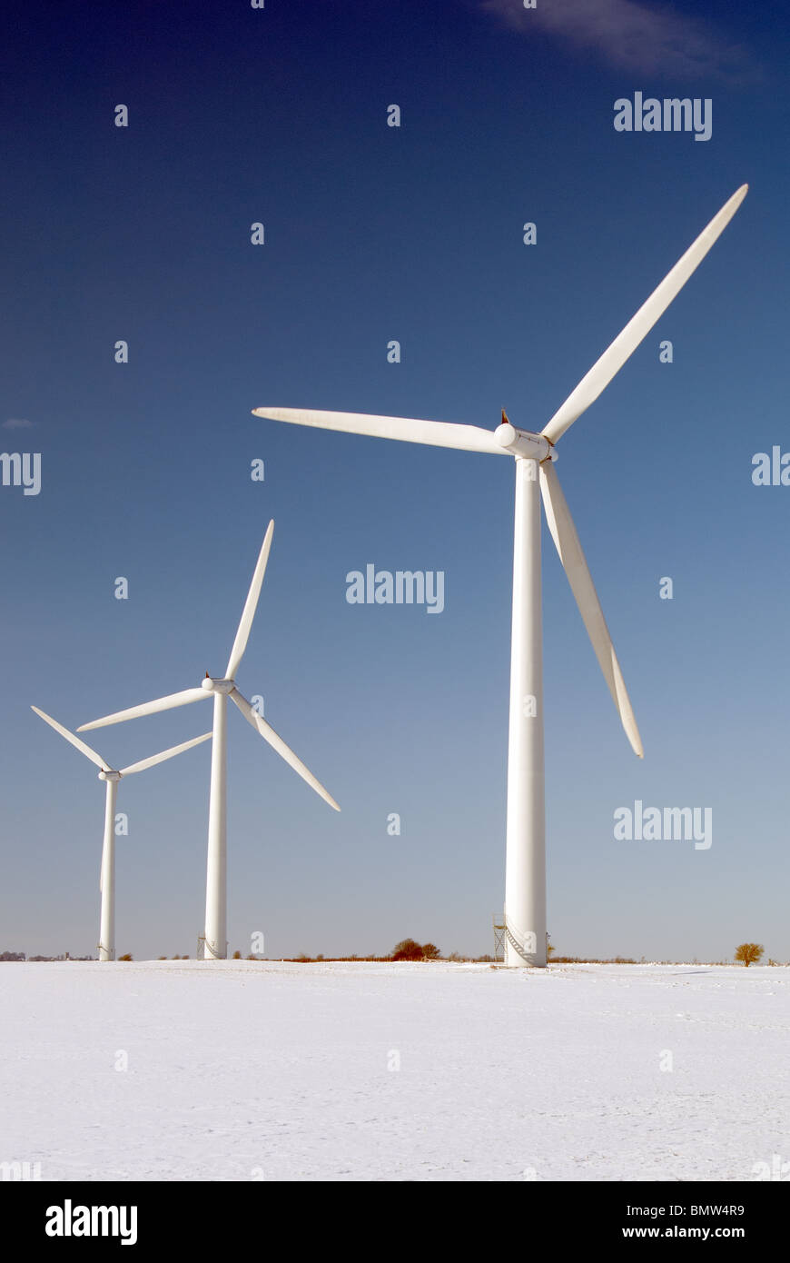 Wind turbines in the snow at the Westmill Windfarm co-operative in Oxfordshire, UK. Stock Photo