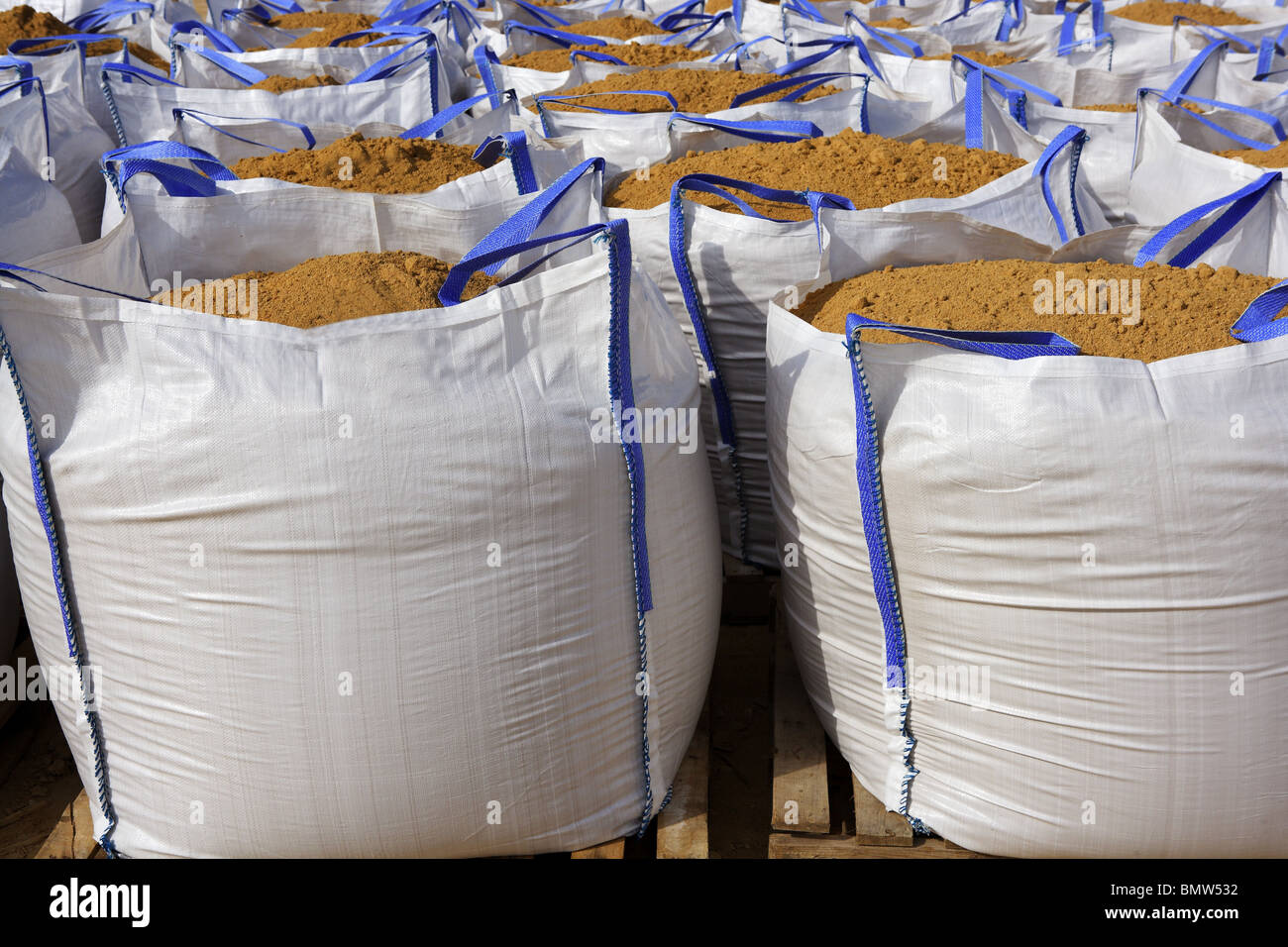 sandbag white big bag sand sacks on quarry Stock Photo - Alamy