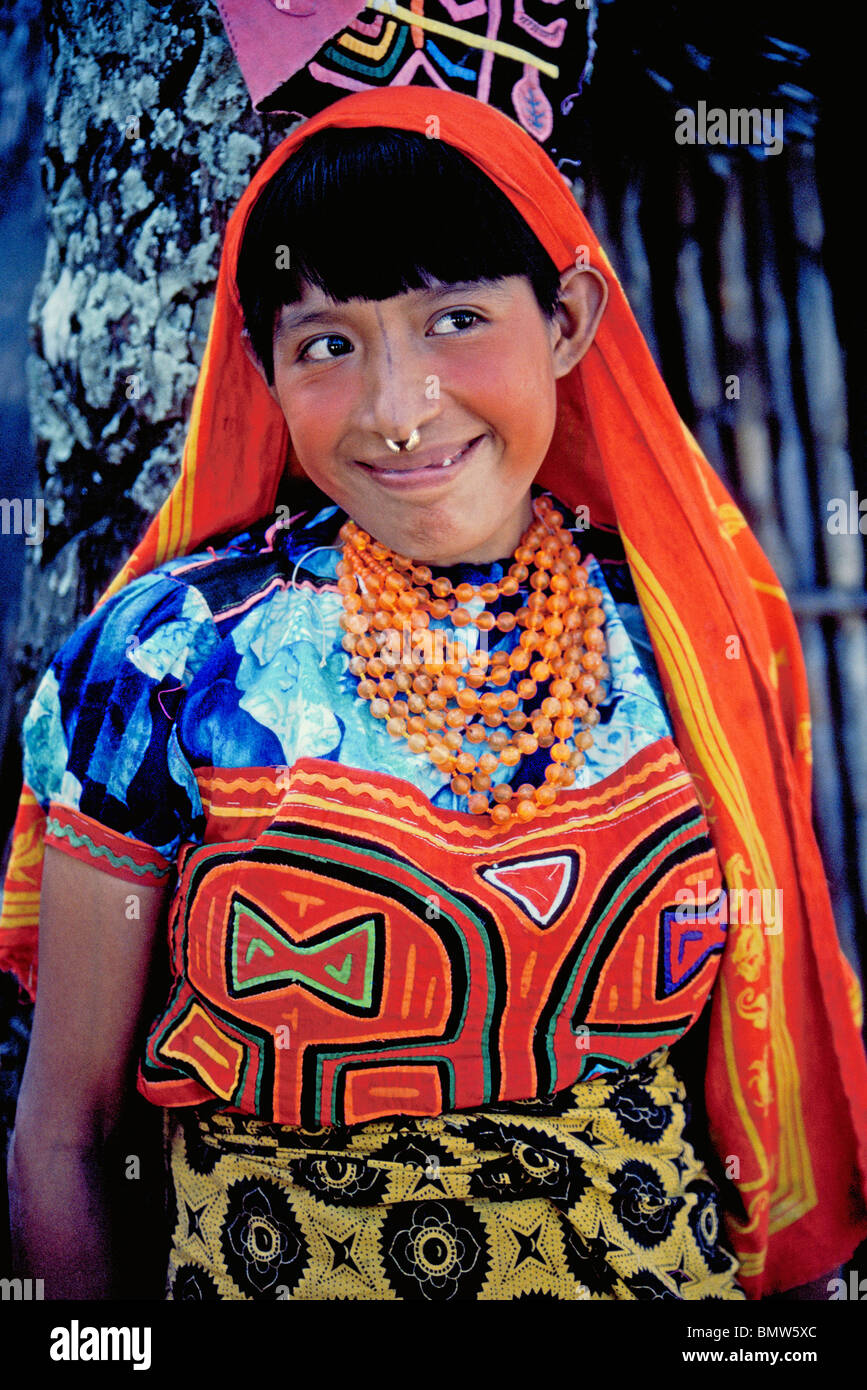 A Kuna (Cuna) Indian girl wears the handmade mola that is a feature of her blouse and traditional women's clothing in the San Blas Islands of Panama. Stock Photo