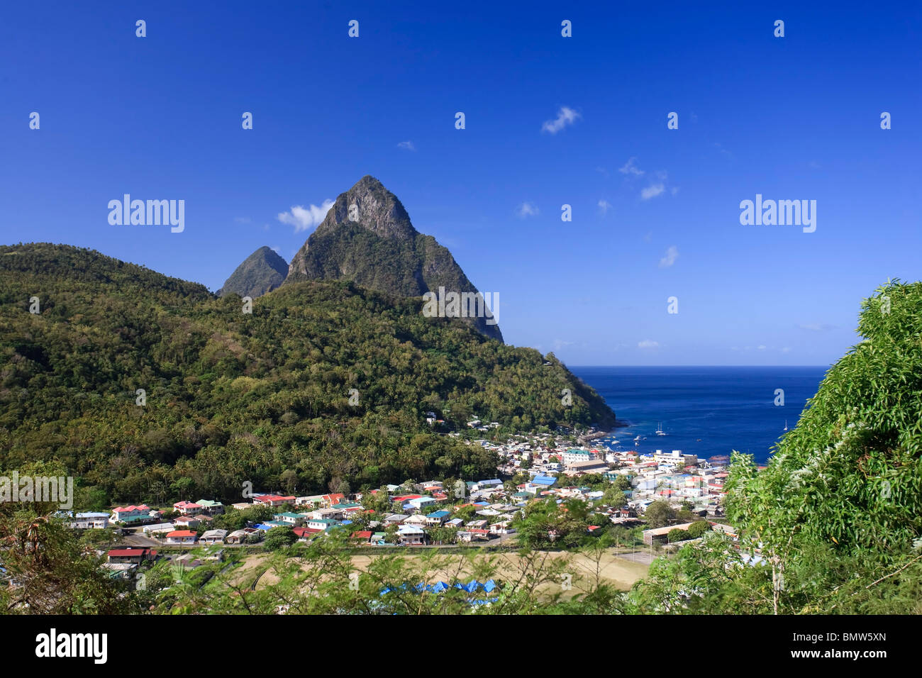 Caribbean, St Lucia, Petit and Gros Piton Mountains (UNESCO World Heritage Site) and town of Soufriere Stock Photo
