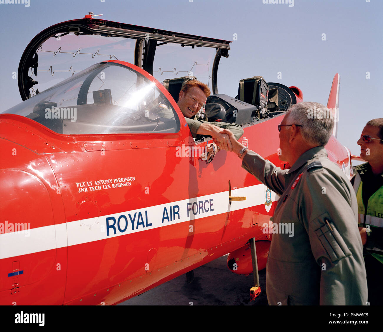 Senior officer congratulates other pilots of the 'Red Arrows', Britain