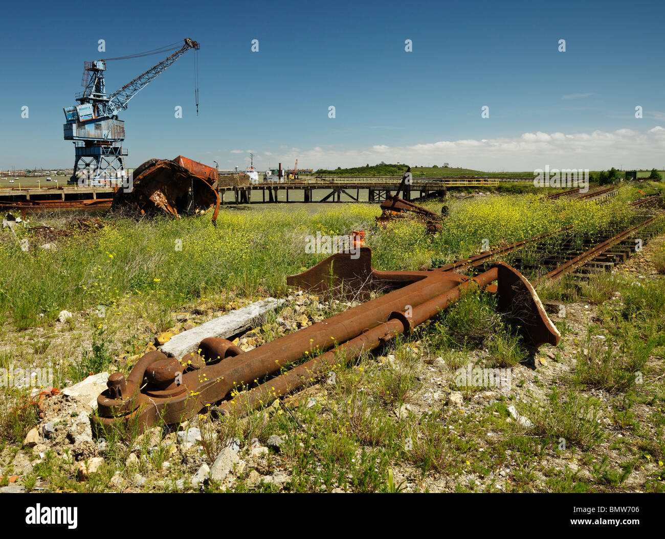 Rusty old anchor used as a railway buffer stop. Stock Photo