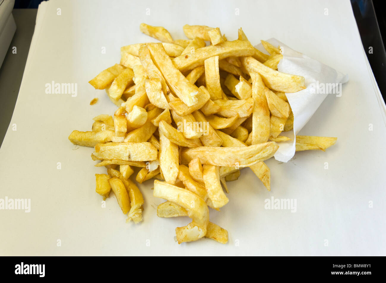 Portion of chips at fish and chip shop, England, UK Stock Photo