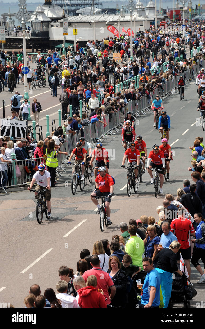 Cyclists reach the finish at Madeira Drive after taking part in the London to Brighton Bike Ride UK Stock Photo