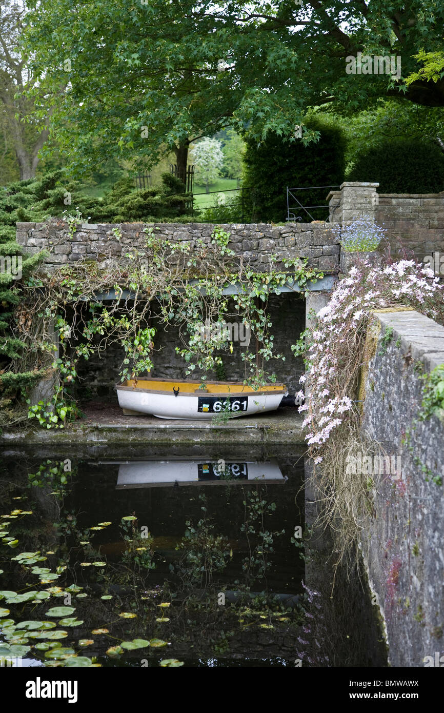 Rowing boat in a stone boat house Stock Photo