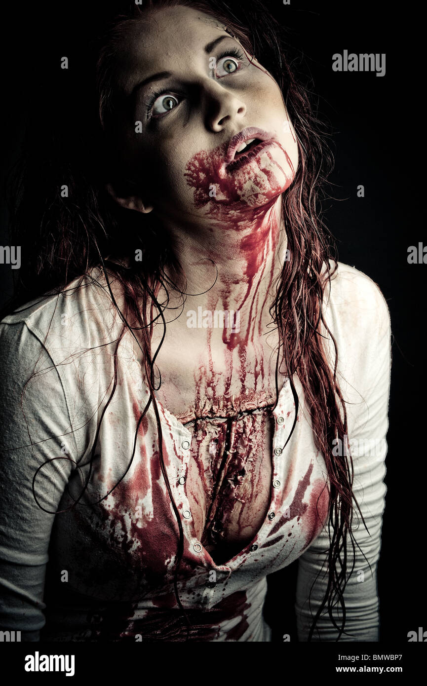 a bloody and scary looking zombie girl Stock Photo