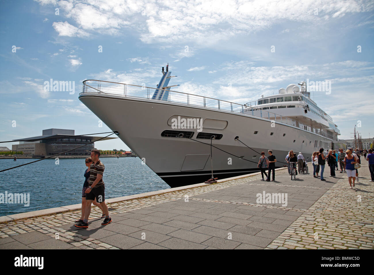 The luxury yacht The MS Rising Sun in the port of Copenhagen with the new opera house in the background. Stock Photo