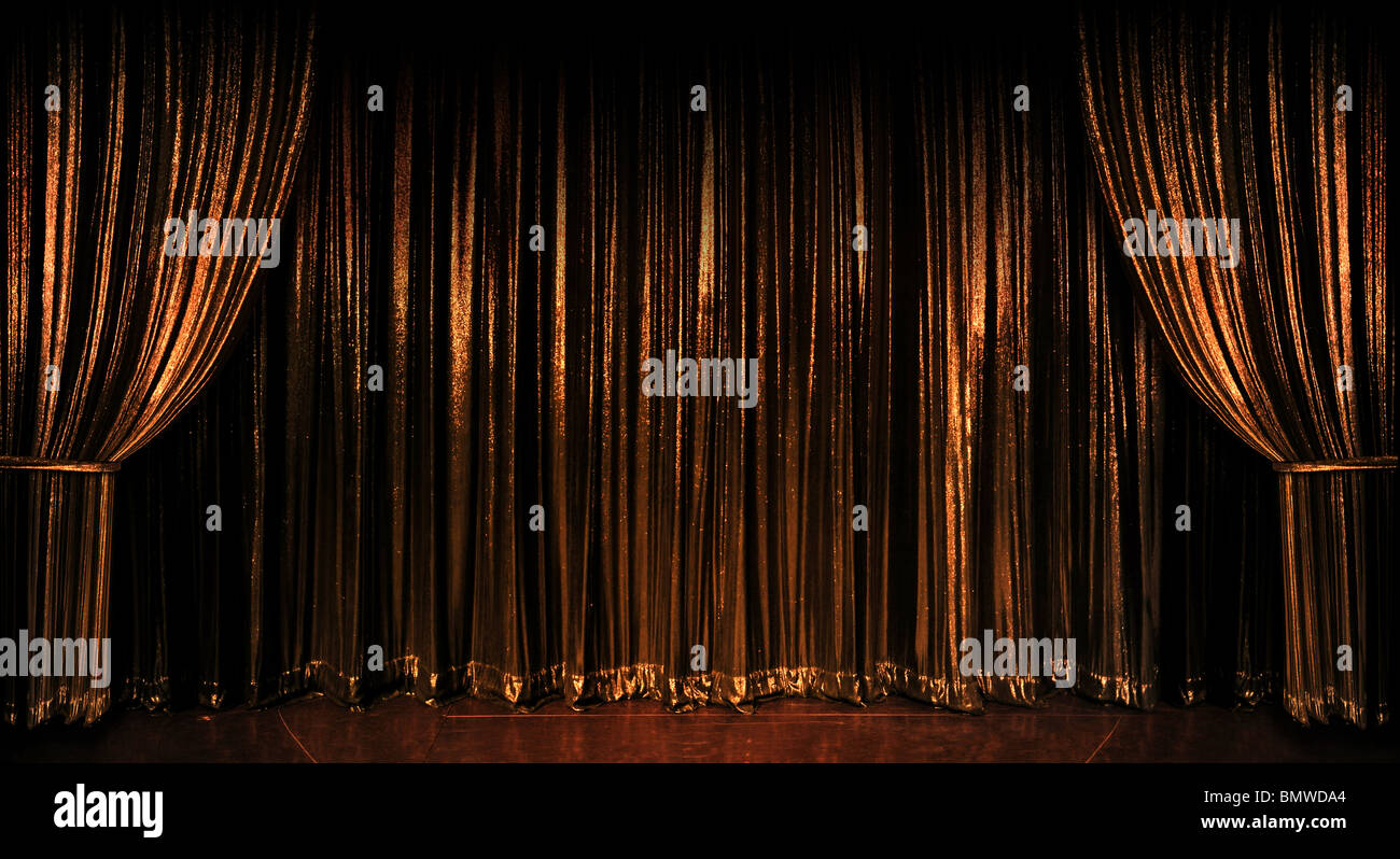 Stage golden curtains over wooden floor Stock Photo